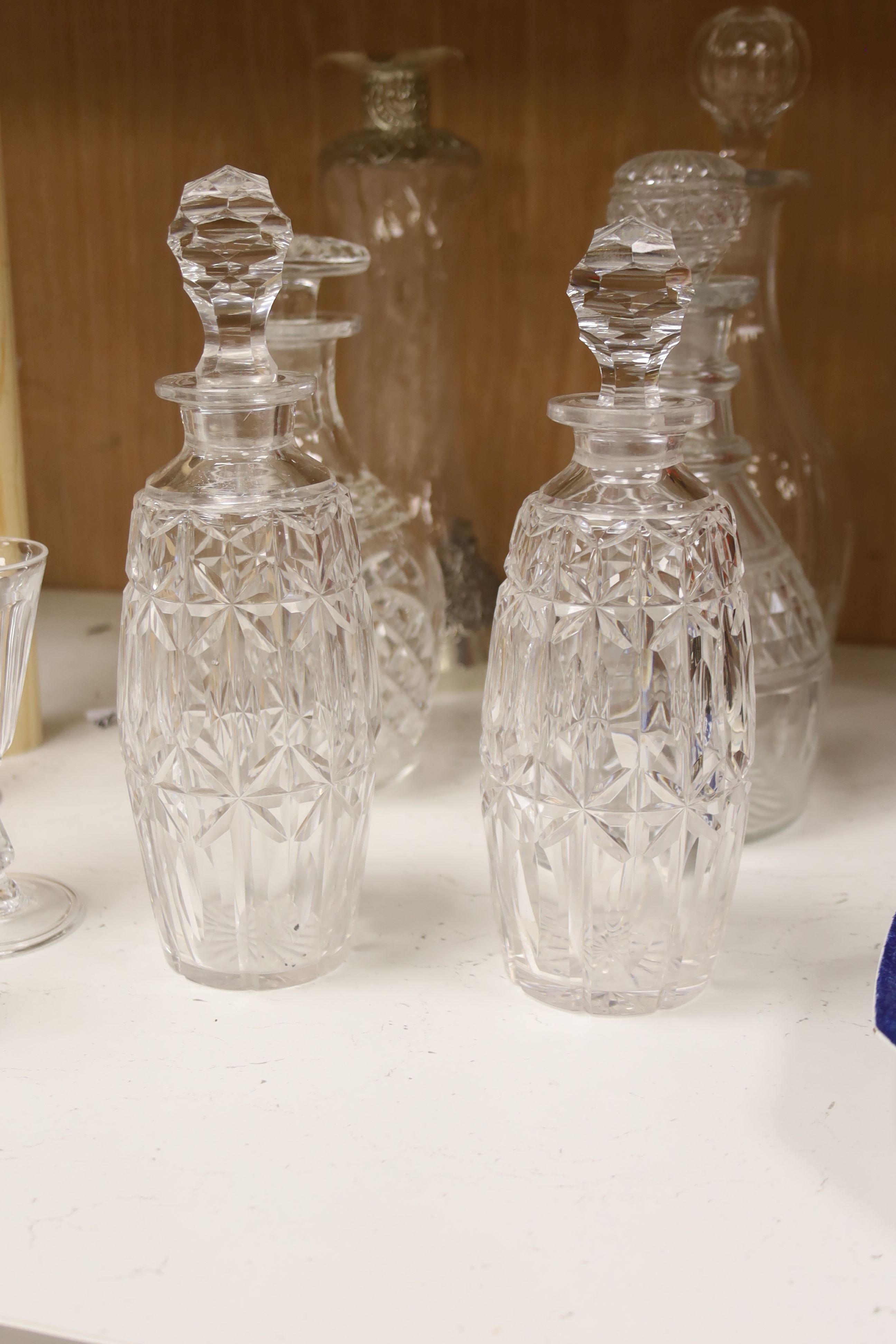A cut glass punch bowl and a collection of table glassware, to include a late Victorian silver mounted decanter (lacking stopper)